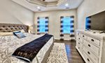 Master bedroom suite with king bed on main floor